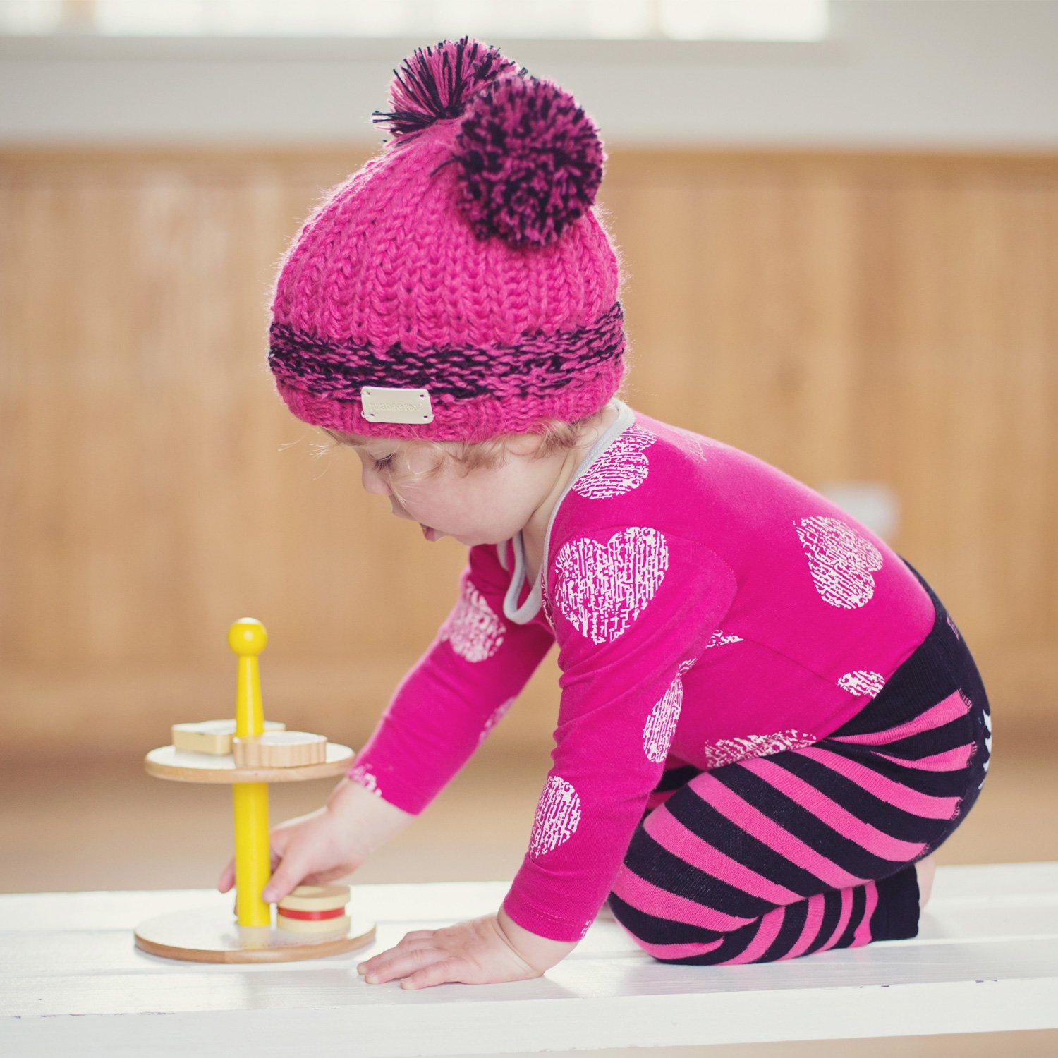 pink bobble hat