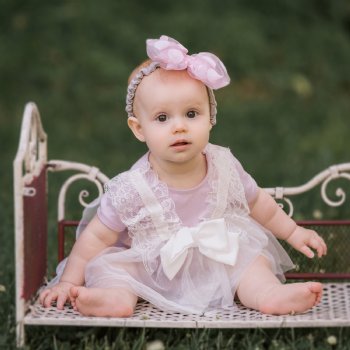 Mae Li Rose Lace and Bow Onesie in Lavender