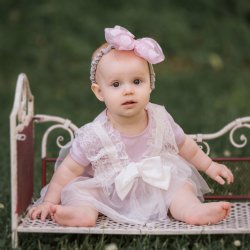 Mae Li Rose Lace and Bow Onesie in Lavender