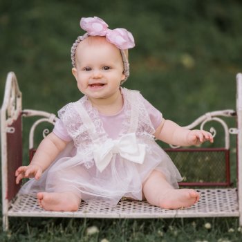 Mae Li Rose Lace and Bow Onesie in Soft Peach