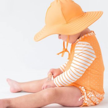 Ruffle Butts Melon Polka Dot One Piece Rash Guard